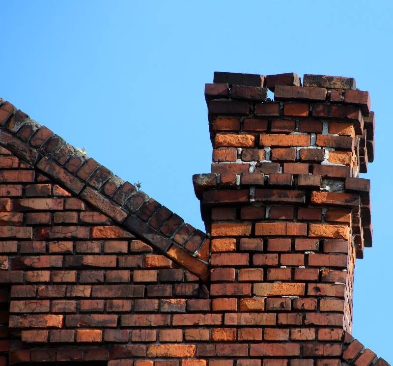 Signs Your Buena Park Home Needs a Chimney Inspection Damaged chimney on an Buena Park home showing cracks and missing mortar